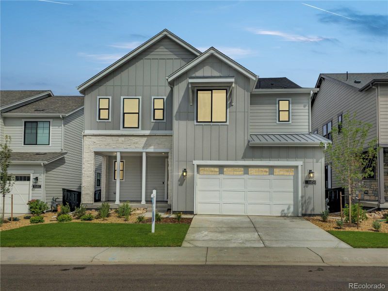 Front exterior of a new home in Stargaze at Solstice, Littleton, CO, highlighting curb appeal (Image 1).