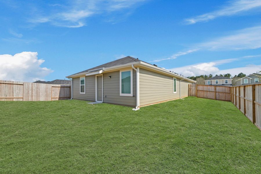 Exterior details and patio area of a home in The Canopies, Splendora (Image 5).