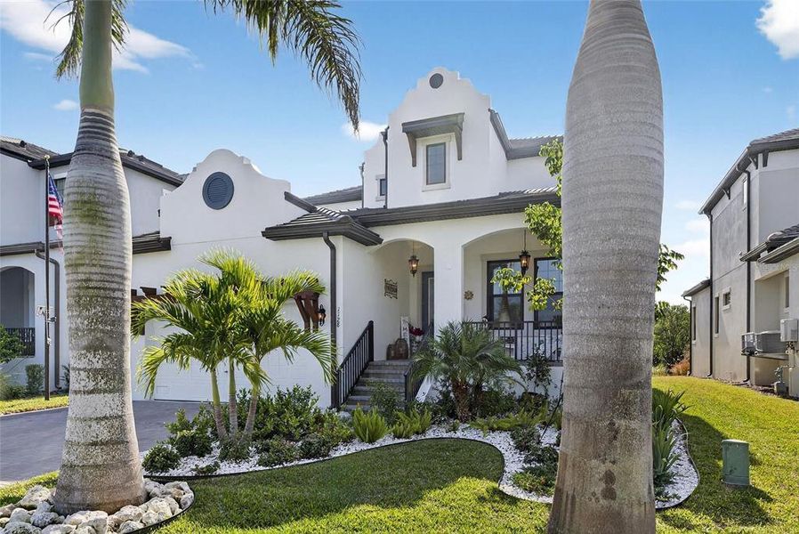 Front exterior of a new home in SouthShore Yacht Club: Somerset Preserve, Ruskin, FL, highlighting curb appeal (Image 25).