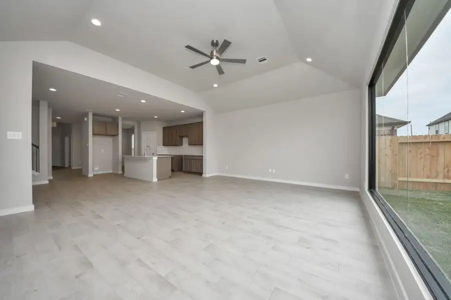 Take another glimpse at the heart of the home with this additional view of the family room. Sample photo of completed home with similar floor plan. Actual colors and selections may vary. Take another glimpse at the heart of the home with this additional view of the family room. Sample photo of completed home with similar floor plan. Actual colors and selections may vary.