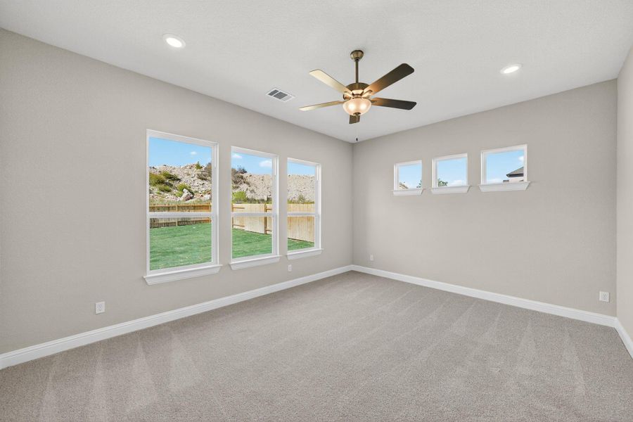 Empty room featuring light carpet, recessed lighting, and a ceiling fan Empty room featuring light carpet, recessed lighting, and a ceiling fan