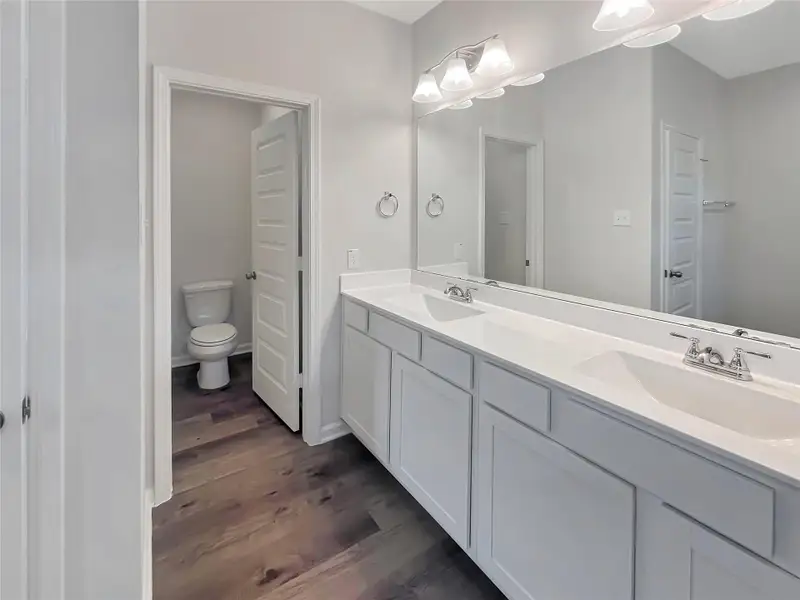 The Oriole II- Primary Bathroom with Dual Sinks. Home under construction, photo used for illustrative purposes only, colors and options will vary.