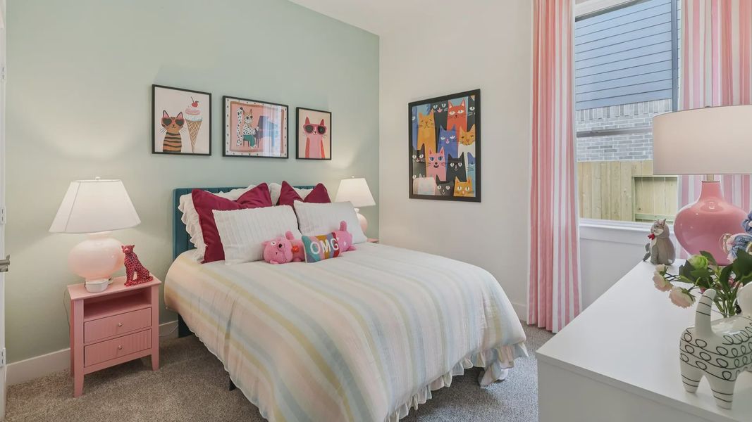 Representative furnished interior of a home built from the Adele by Chesmar Homes in Sunterra, Katy (Image 19).