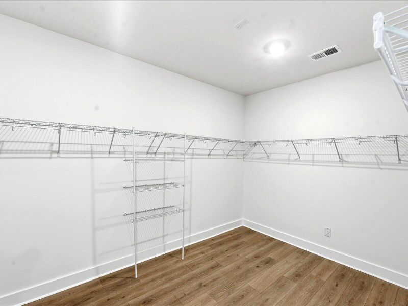 Spacious, unfurnished interior of a new home in The Coves at Lakes of Cane Bay II, Summerville (Image 32).