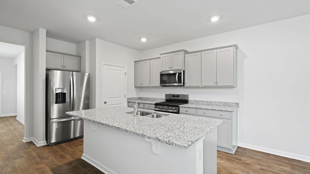 Furnished interior view inside a new home in Pine Hills at Cane Bay, Summerville (Image 3). Furnished interior view inside a new home in Pine Hills at Cane Bay, Summerville (Image 3).
