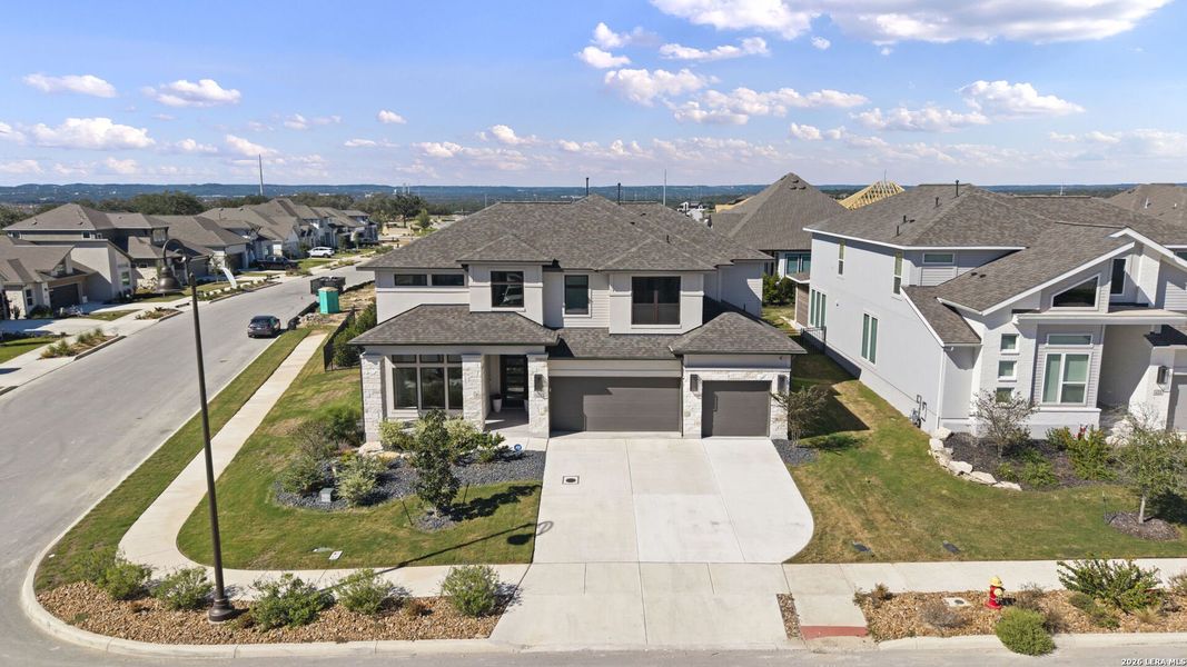 Front exterior of a new home in Esperanza, Boerne, TX, highlighting curb appeal (Image 29).