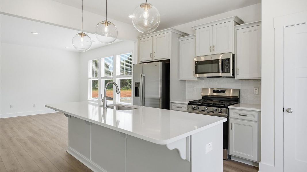 Accomplished layout with a stunning 9-foot island, pendant lighting, and superior craftsmanship at Barton Hollow