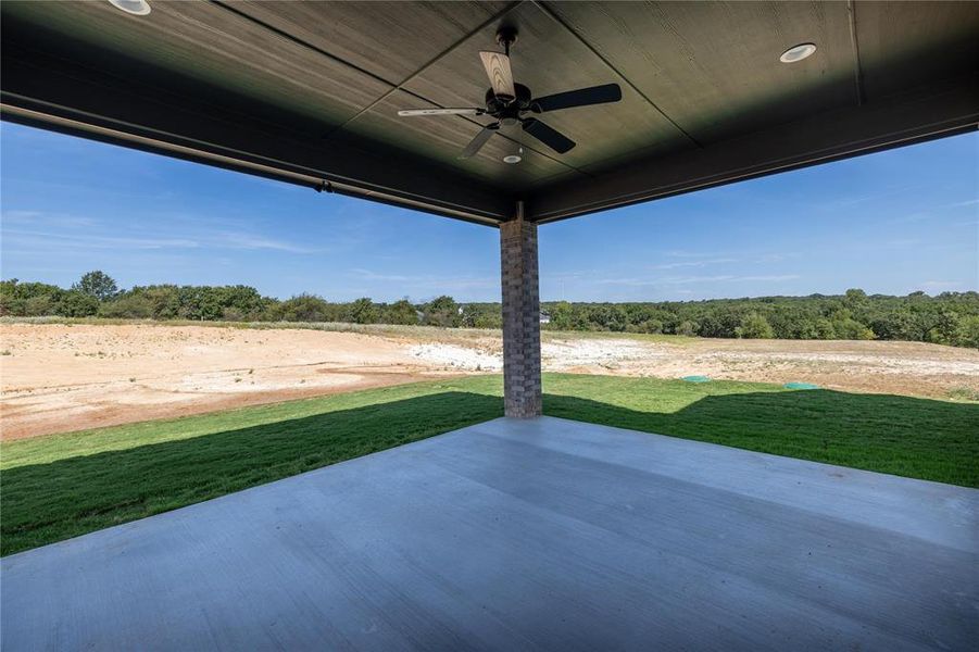 View of patio featuring ceiling fan