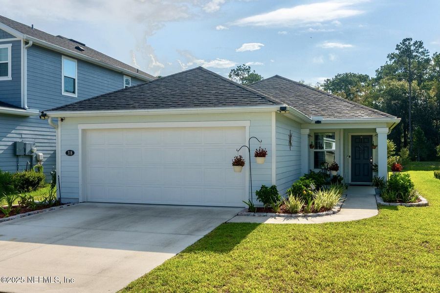 Front exterior of a new home in Brookside Preserve, St. Johns, FL, highlighting curb appeal (Image 2).
