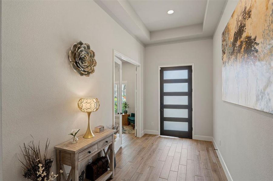 As soon as you enter the home you are greeted by a well lit, wide entry way