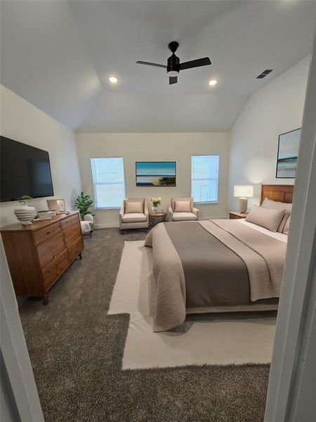 Carpeted bedroom featuring ceiling fan, lofted ceiling, and multiple windows