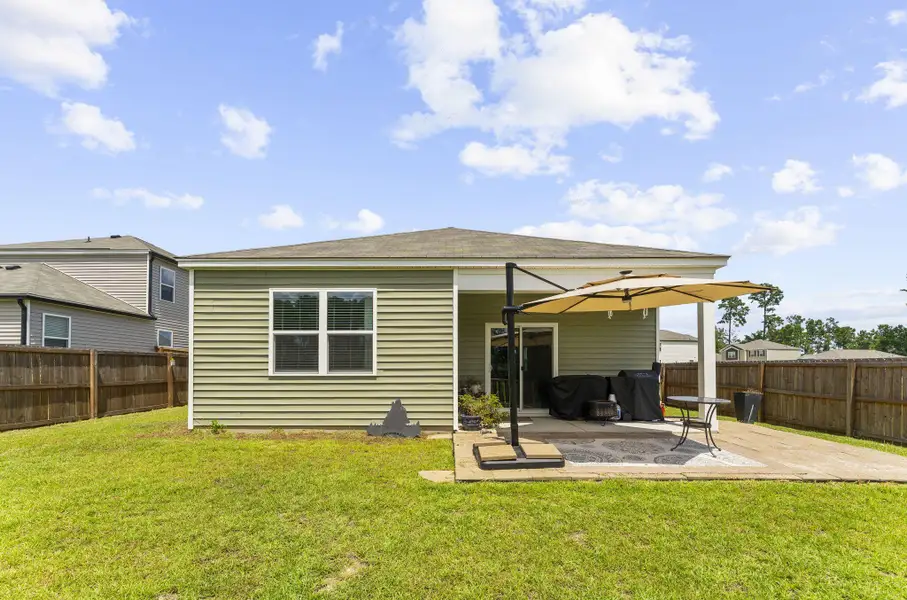 Exterior details and patio area of a home in Pine Hills at Cane Bay, Summerville (Image 4).