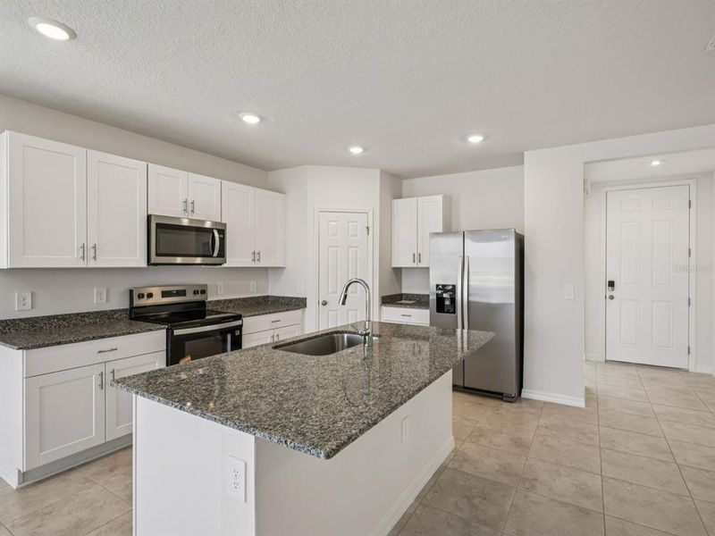 Furnished interior view inside a new home in Villamar - Signature Series, Winter Haven (Image 5).