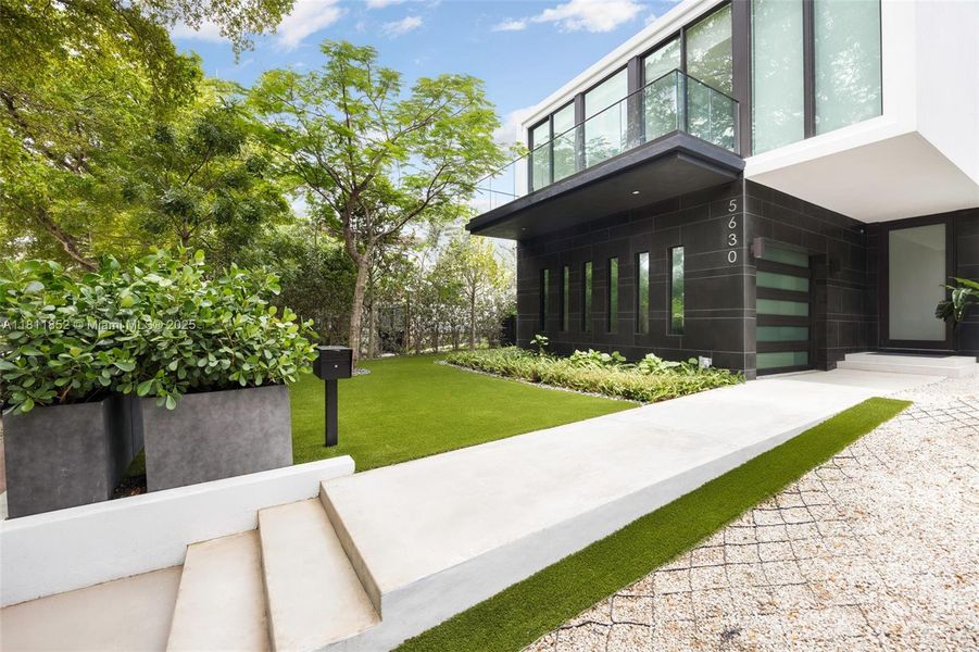 Front exterior of a new home in , Miami Beach, FL, highlighting curb appeal (Image 28). Front exterior of a new home in , Miami Beach, FL, highlighting curb appeal (Image 28).