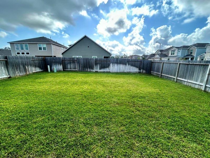 Front exterior of a new home in Enclave at Dobbin, Magnolia, TX, highlighting curb appeal (Image 1).