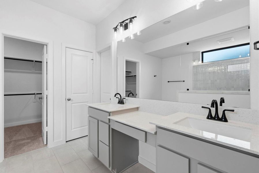 Spa-inspired primary bathroom with dual vanities