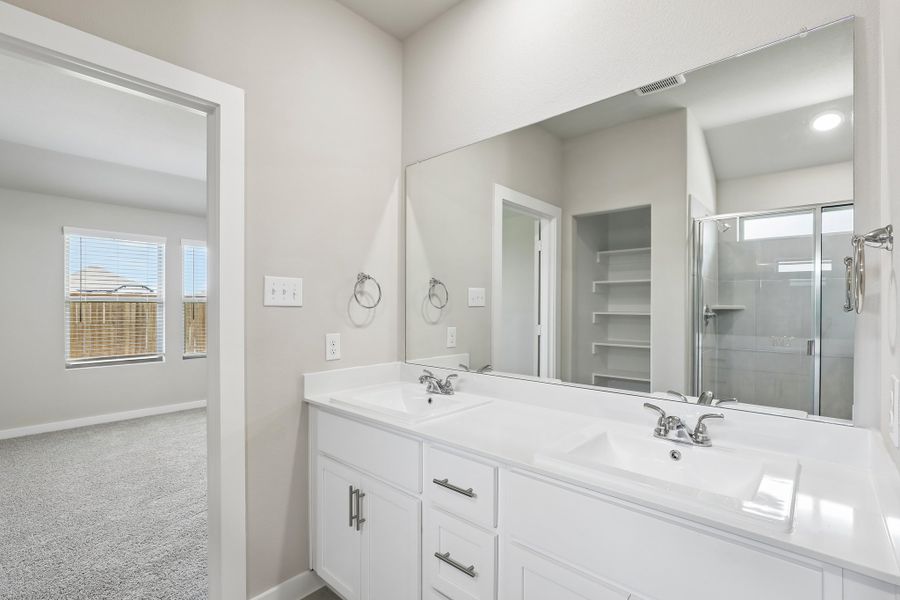 Primary Bathroom in the Oscar home plan by Trophy Signature Homes