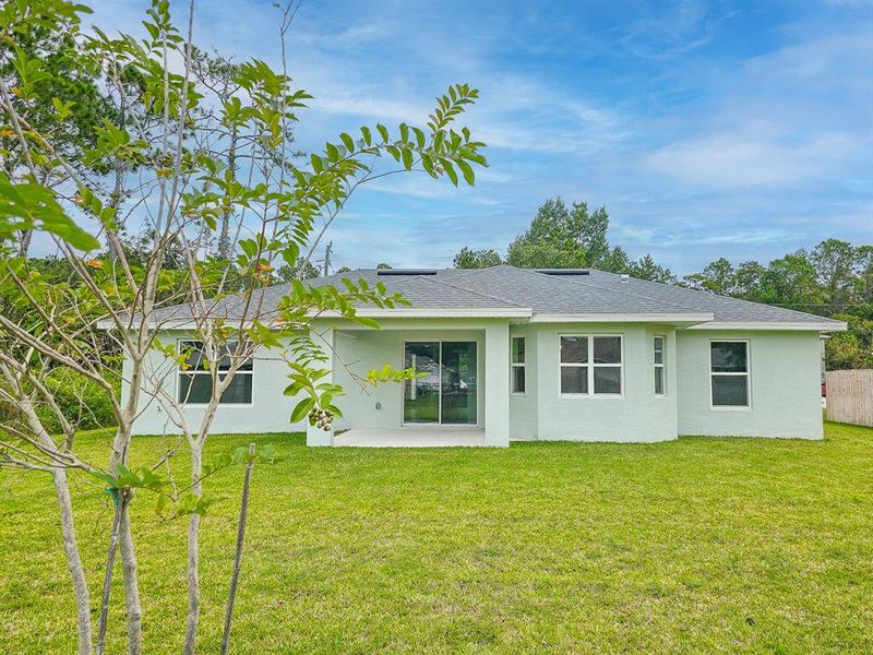 Front exterior of a new home in , Palm Coast, FL, highlighting curb appeal (Image 25).