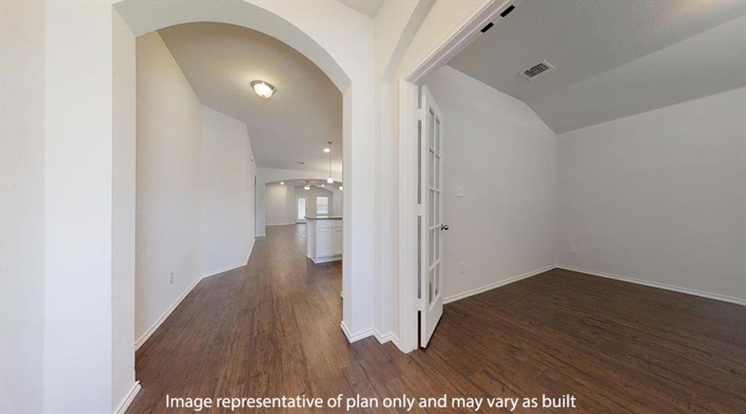 Hall featuring arched walkways, dark wood finished floors, and lofted ceiling Hall featuring arched walkways, dark wood finished floors, and lofted ceiling