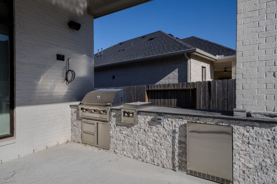 Exterior details and patio area of a home in Audubon, Magnolia (Image 26).