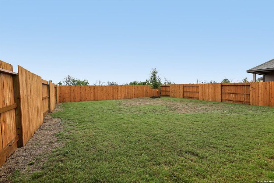 Exterior details and patio area of a home in Hightop Ridge, Converse (Image 26).