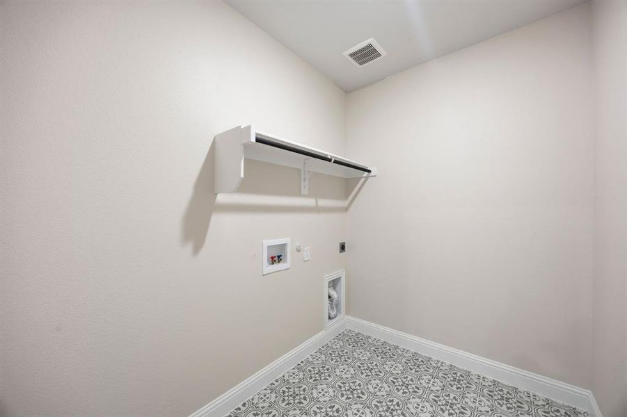 Laundry room with hookup for a dryer hookup, and washer hookup