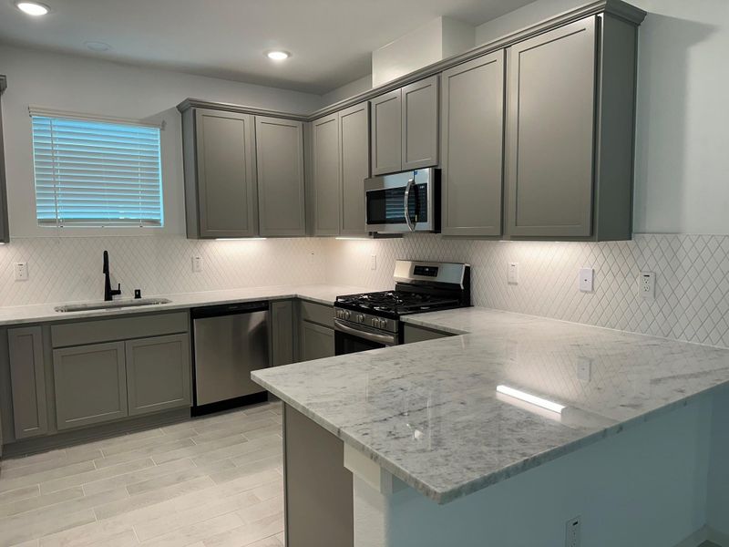 Furnished interior view inside a new home in Creekhaven, Iowa Colony (Image 5).