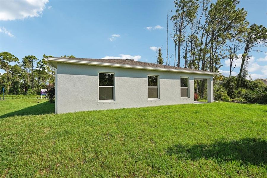Exterior details and patio area of a home in North Port Classic, North Port (Image 33).