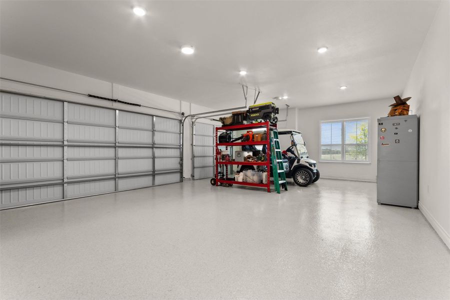 Extra large 3 CAR garage with PRISTINE EPOXY flooring and storage. Extra large 3 CAR garage with PRISTINE EPOXY flooring and storage.