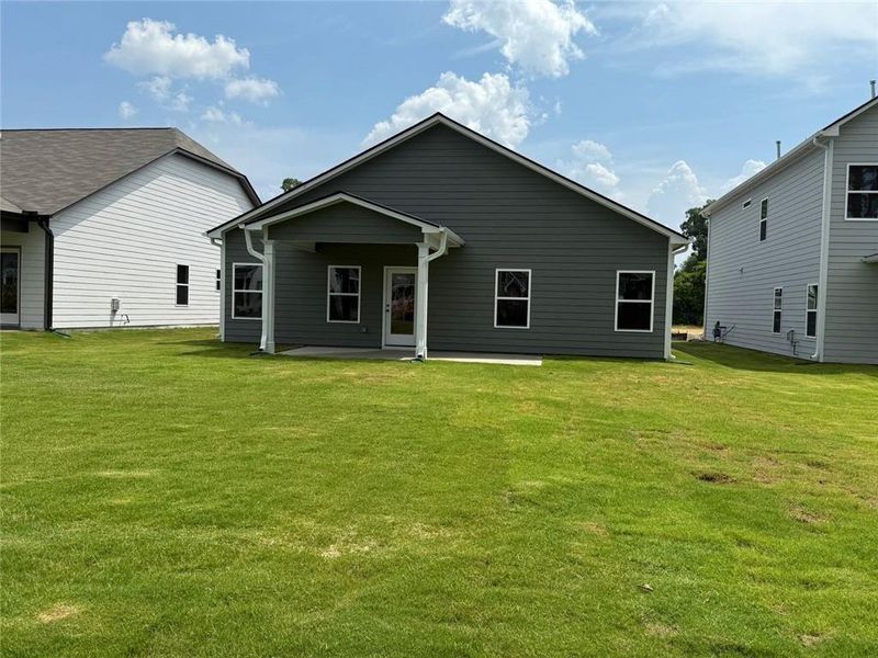 Exterior details and patio area of a home in Garrett Preserve, Douglasville (Image 3).