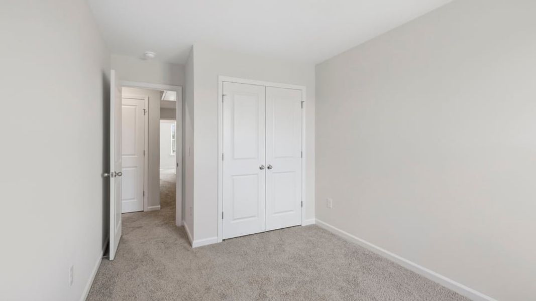 Spacious, unfurnished interior of a new home in Tanglewood Townes, Greenville (Image 26).