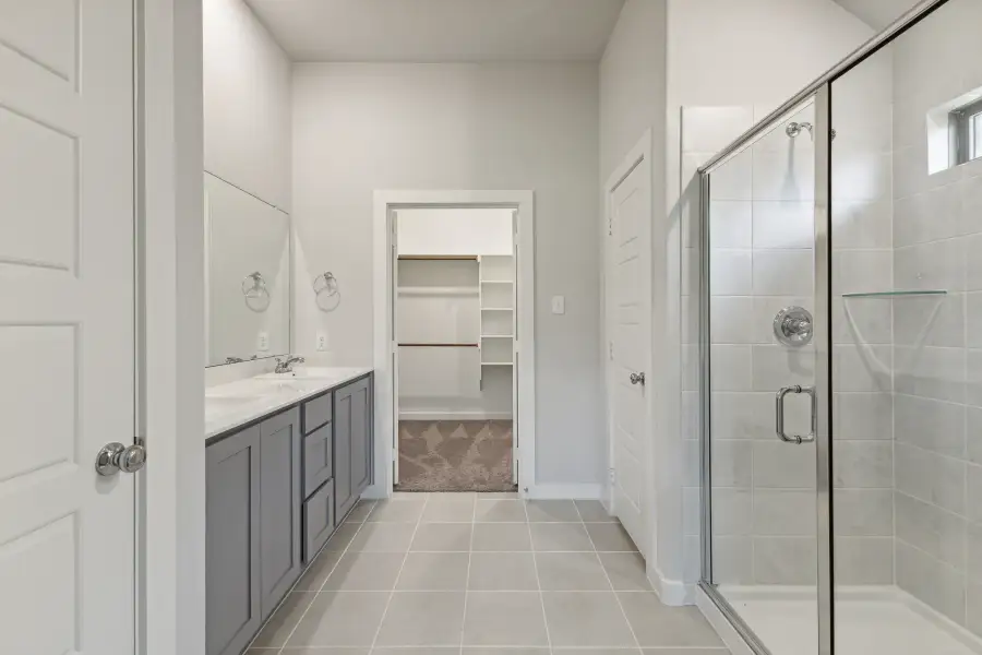 Primary Bathroom in the Quartz home plan by Trophy Signature Homes – REPRESENTATIVE PHOTO
