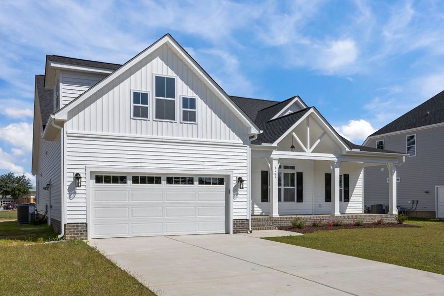 Front exterior of a new home in The Preserve at Langston, Winterville, NC, highlighting curb appeal (Image 24).