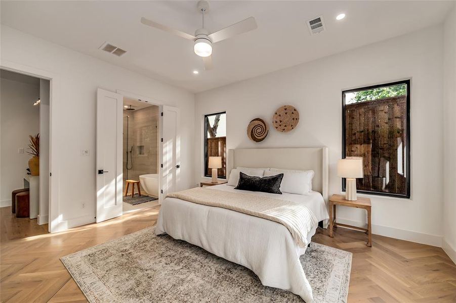 Bedroom with recessed lighting, ensuite bath, and a ceiling fan Bedroom with recessed lighting, ensuite bath, and a ceiling fan