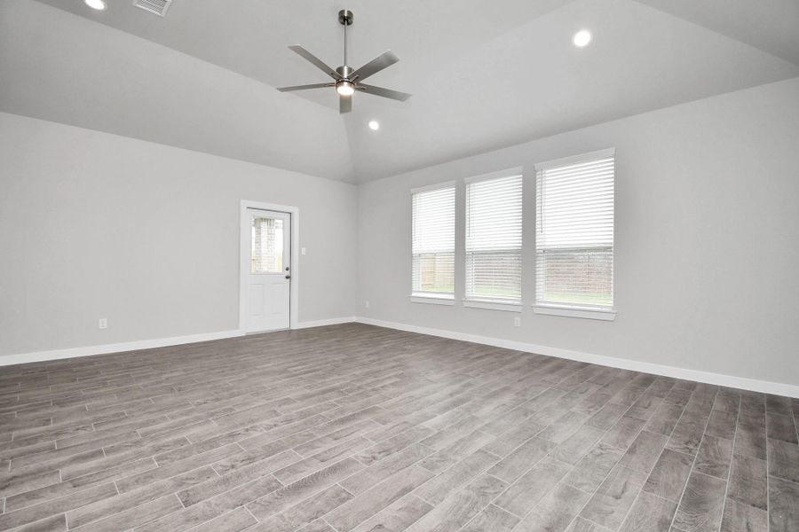 Another view of family room area. Sample photo of completed home with similar floor plan. Actual colors and selections may vary.