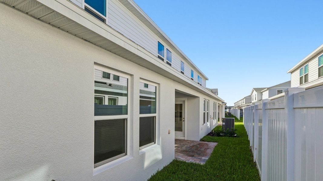 Exterior details and patio area of a home in Cyrene at Harmony, St. Cloud (Image 23).