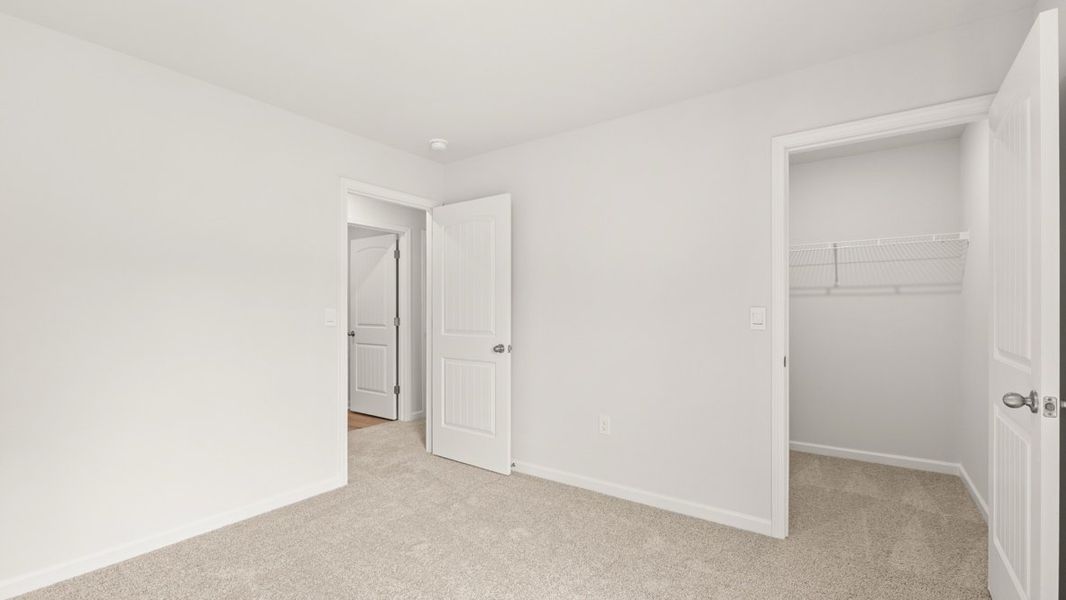 Representative unfurnished interior of a home built from the Darwin by D.R. Horton in Oaks at Cedar Grove, Fairburn (Image 29).