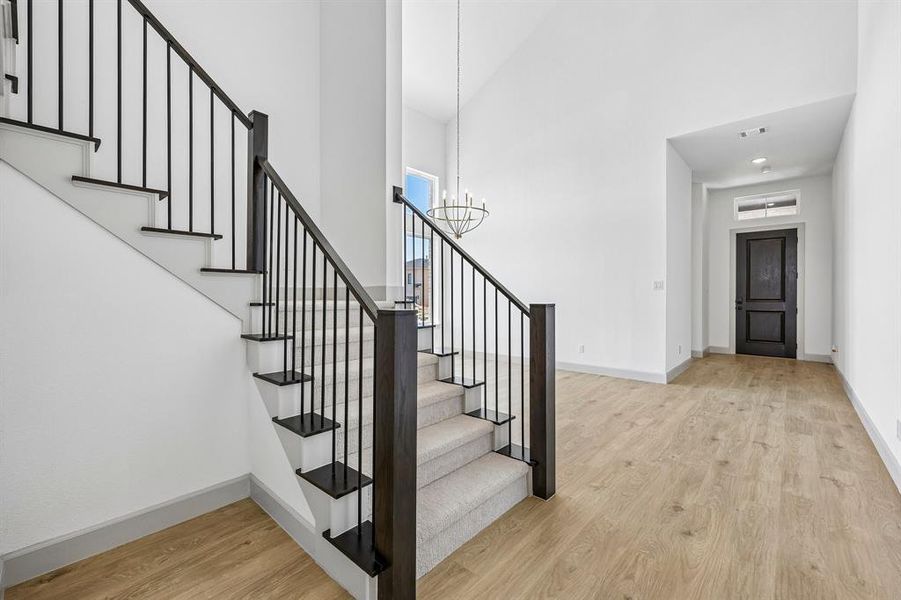 Offering a welcoming entry with a dramatic, wrought iron railing stair case and ample room to display art work, our Genevieve floor plan is the dream home you have been searching for! Offering a welcoming entry with a dramatic, wrought iron railing stair case and ample room to display art work, our Genevieve floor plan is the dream home you have been searching for!