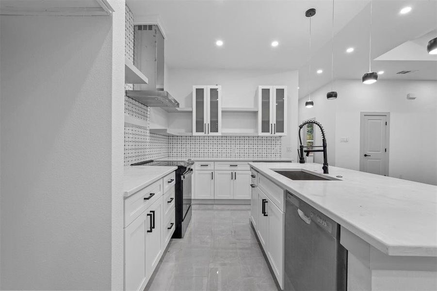 Kitchen with dishwasher, sink, electric range, decorative light fixtures, and white cabinetry