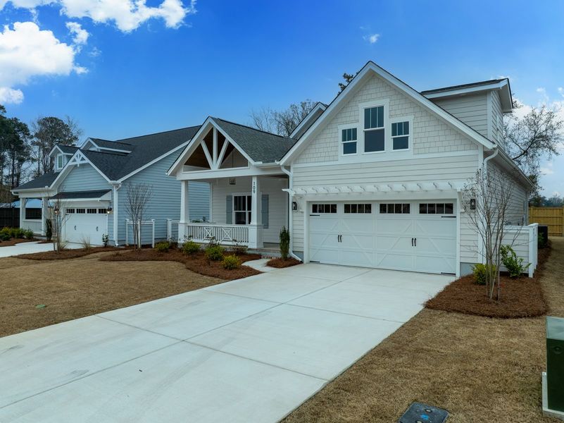 Representative exterior photo of a completed home built from the Kauai by Bill Clark Homes in The Sanctuary at Sunset Beach, Sunset Beach, NC (Image 32).