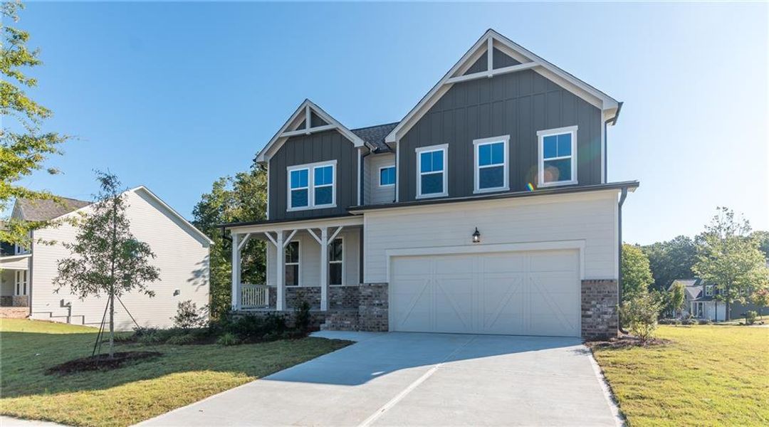 Front exterior of a new home in The Village at Shallowford, Kennesaw, GA, highlighting curb appeal (Image 2). Front exterior of a new home in The Village at Shallowford, Kennesaw, GA, highlighting curb appeal (Image 2).