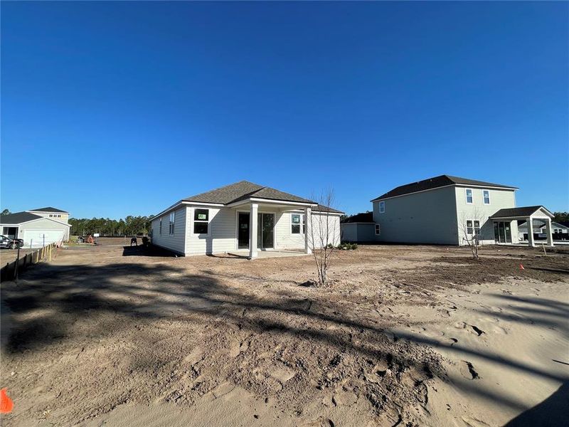 Front exterior of a new home in Magnolia Series at Seminole Palms, Palm Coast, FL, highlighting curb appeal (Image 19).