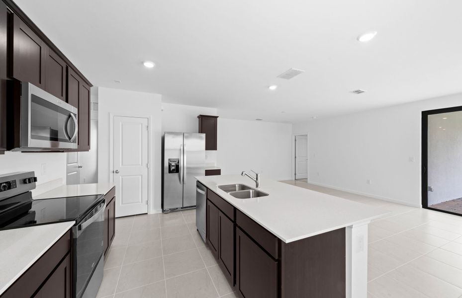 Furnished interior view inside a new home in Caloosa Cove, Labelle (Image 9).