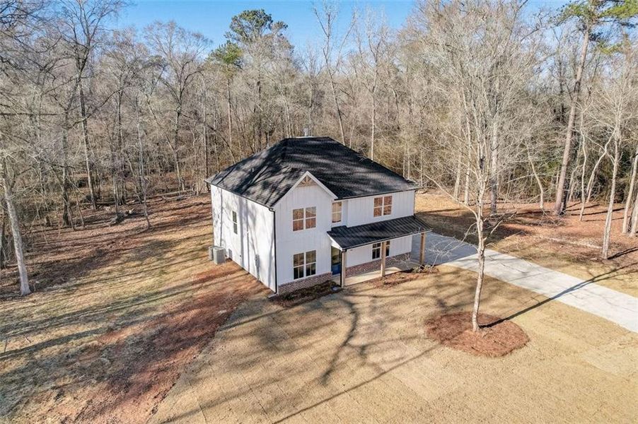 Front exterior of a new home in , Mansfield, GA, highlighting curb appeal (Image 12). Front exterior of a new home in , Mansfield, GA, highlighting curb appeal (Image 12).