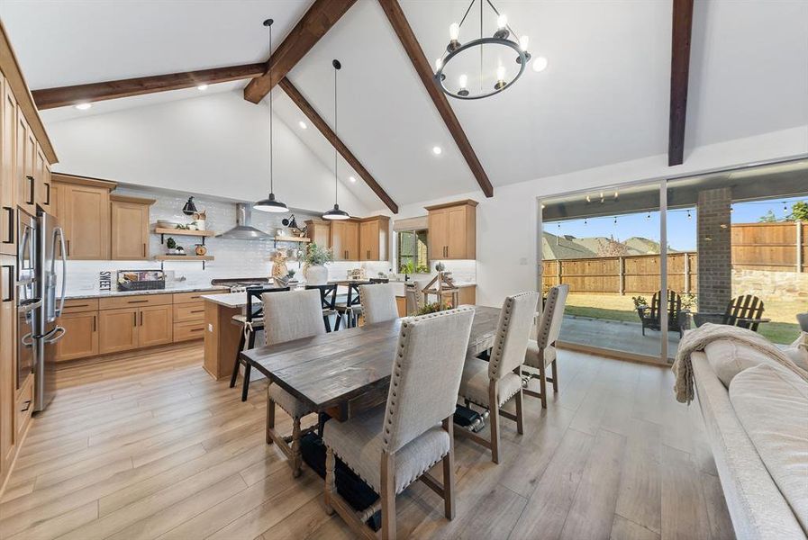 Dining area open to kitchen and living room, ideal for entertaining.