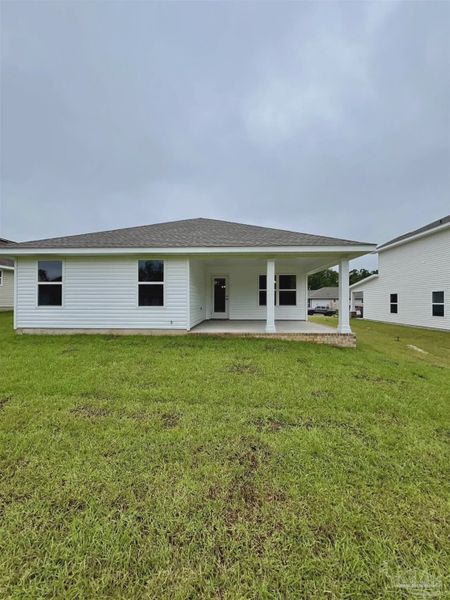 Front exterior of a new home in Pine Top, Cantonment, FL, highlighting curb appeal (Image 2).