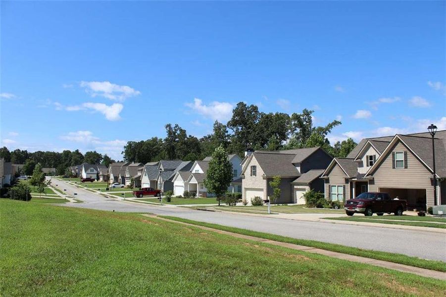 Front exterior of a new home in , Gainesville, GA, highlighting curb appeal (Image 1).