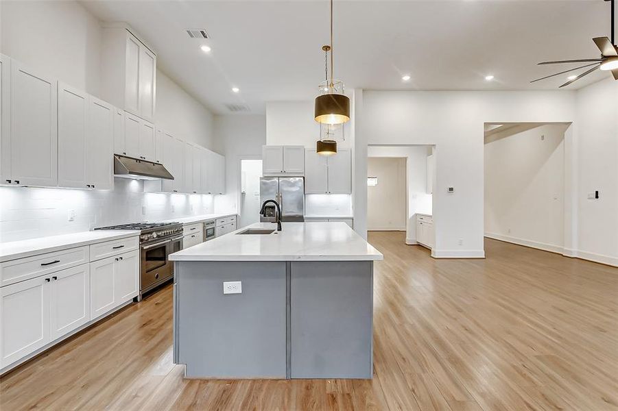 There is ample amounts of storage space for every piece of serving wear, dish, utensil and small appliance in this kitchen.