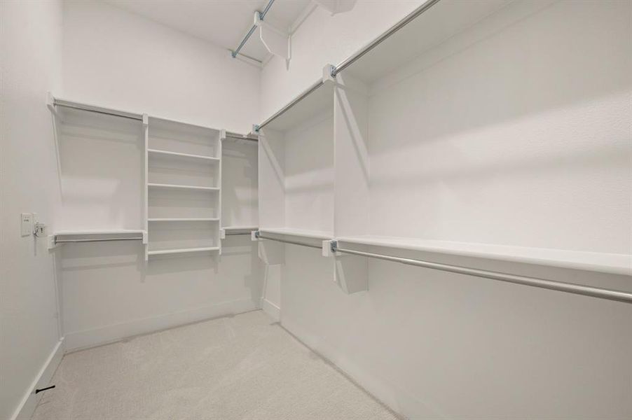 Featuring seasonal hanging racks and plenty of space, this owner's closet is a dream come true! Featuring seasonal hanging racks and plenty of space, this owner's closet is a dream come true!