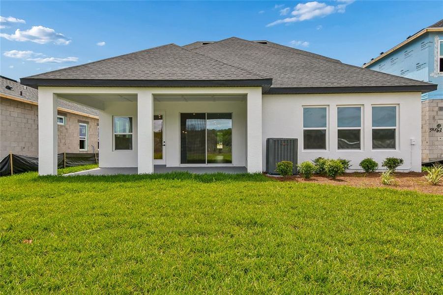 Exterior details and patio area of a home in Oakfield at Mount Dora Village Series, Mount Dora (Image 4).